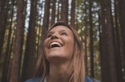 Smiling woman in forest