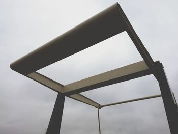 Low angle view of metallic structure against sky