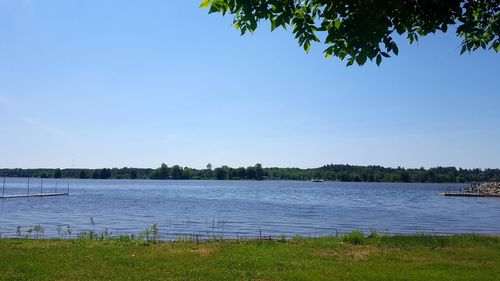 Scenic view of lake against blue sky