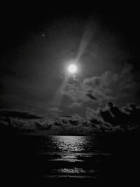 Scenic view of sea against sky at night