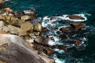 High angle view of rocks in sea