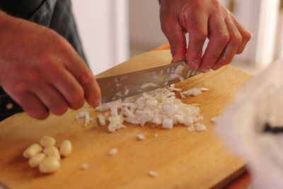 Midsection of chef preparing food