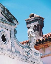 Low angle view of built structure against blue sky