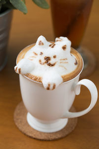 Close-up of coffee cup on table