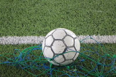 Close-up of soccer ball on field