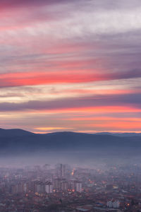 High angle view of buildings against sky during sunset