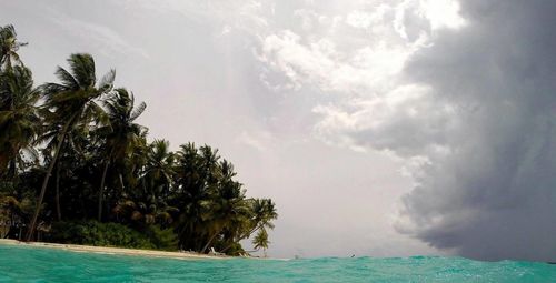 Scenic view of sea against cloudy sky
