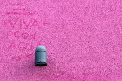 High angle view of pink art on wall