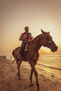 Horse ride in the beach 