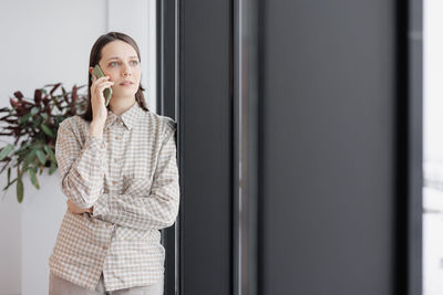 Young woman using phone