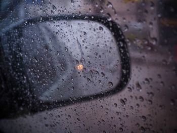 Close-up of raindrops on glass window