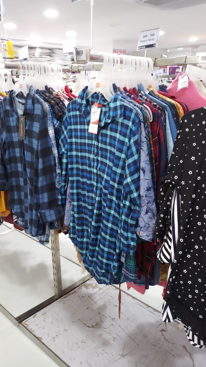 CLOTHES HANGING IN RACK