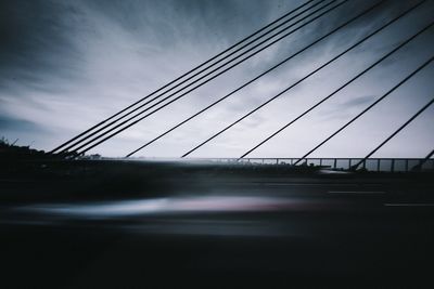 Blurred motion of bridge against sky
