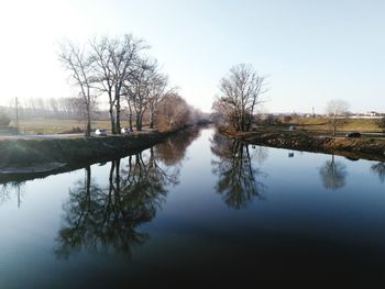 Reflection of trees in calm lake