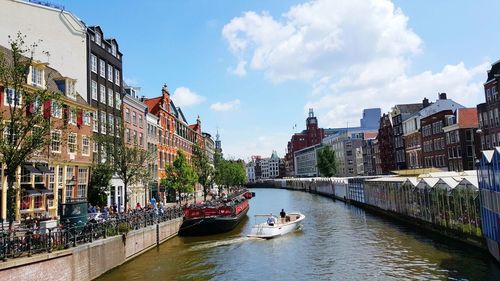 Panoramic view of people in city against sky