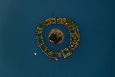 Aerial view of island amidst sea