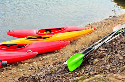 Multi colored boats moored on shore