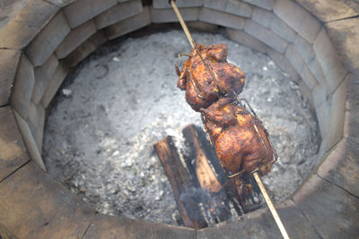 Homemade rotisserie chicken in the backyard.