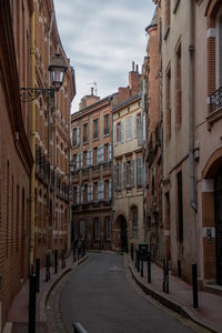 Road in city against sky