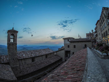 View of buildings in town against sky