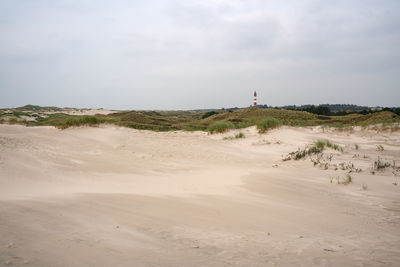 Panoramic image of the dunes of amrum with the lighthouse, germany