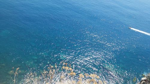 High angle view of sea against blue sky