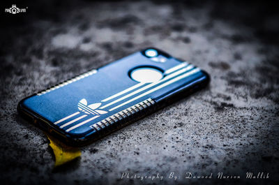 High angle view of smart phone on table
