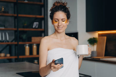 Young woman using mobile phone
