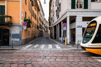 Road amidst buildings in city