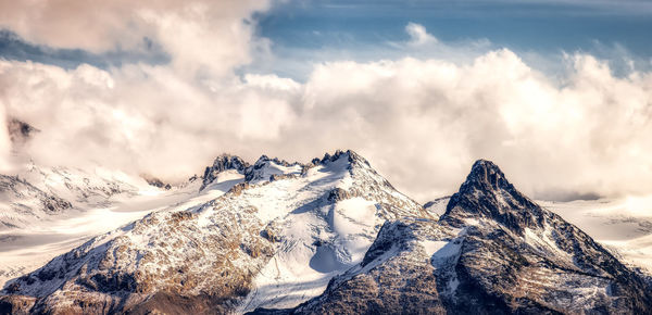 Scenic view of snowcapped mountains against sky