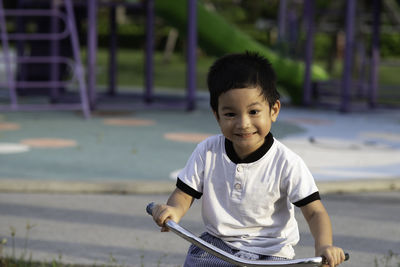 Head shot portrait of 3 years old asian little boy smile and looking at the camera.happy asian kid.