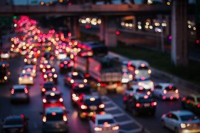 Defocused image of traffic on city street at night