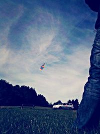 People walking on grassy field