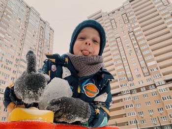 Portrait of a boy in winter on the street