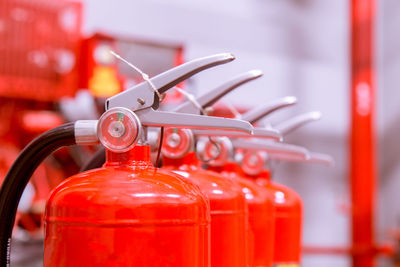 Close-up of red fire extinguishers