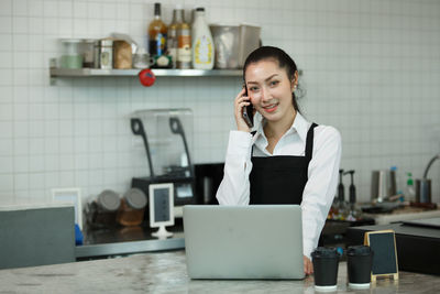 Businesswoman working at desk in office