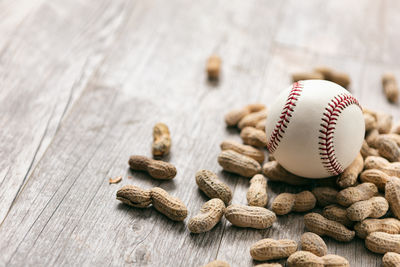 Close-up of baseball on wooden table