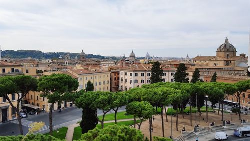 View of buildings in city against sky