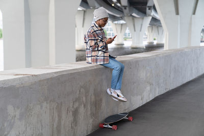 Full length of man skateboarding on skateboard