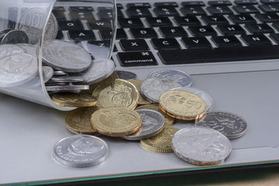 High angle view of coins on table