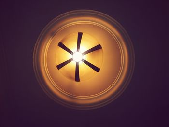 Low angle view of illuminated light bulb