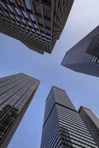 Low angle view of modern buildings against sky