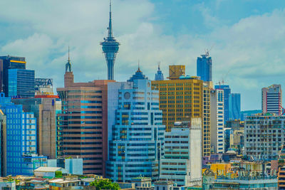 Modern buildings in city against sky