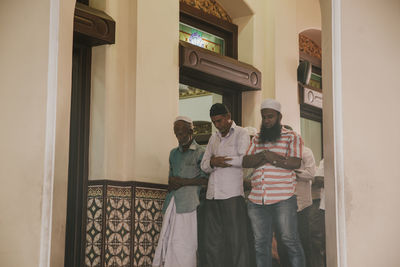 People standing in front of building