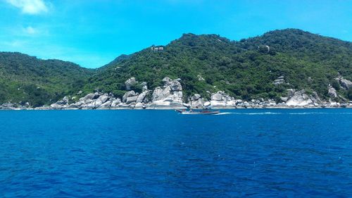 Scenic view of sea against clear blue sky