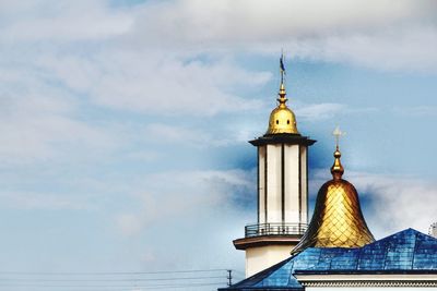 High section of temple building against cloudy sky