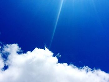 Low angle view of vapor trails in sky