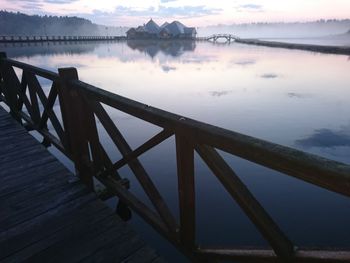 Bridge over lake against sky