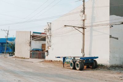 Trailer on road by building