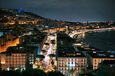 High angle view of illuminated buildings in city at night